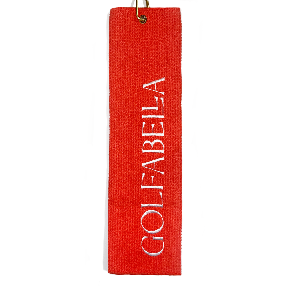 
                      
                        Crafted with textured wicking fabric and trimmed with the iconic Golfabella logo in white embroidery, this towel will keep your clubs clean while adding a pop of color to your golf gear.
                      
                    